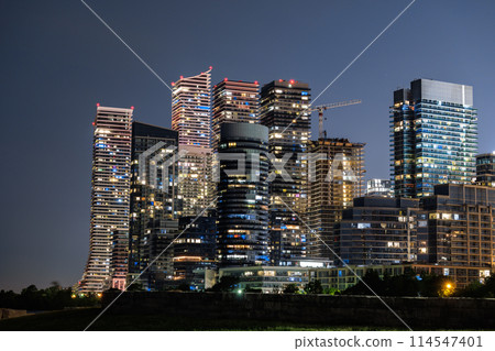 Night view of illuminated modern skyscrapers Night view of illuminated modern skyscrapers 114547401