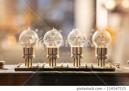 Row of glowing vintage vacuum tubes 114547525