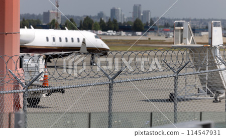 Small aircraft parked at regional airport terminal Small aircraft parked at regional airport terminal 114547931