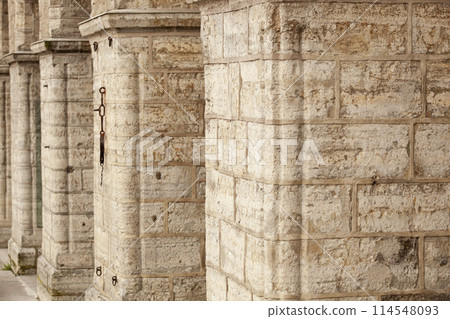 Old brick wall with arches. Weathered surface of the wall. Grunge style brick wall background. Weathered facade of a building. Horizontal. Old brick wall with arches. Weathered surface of the wall. Grunge style brick wall background. Weathered facade of a building. Horizontal. 114548093