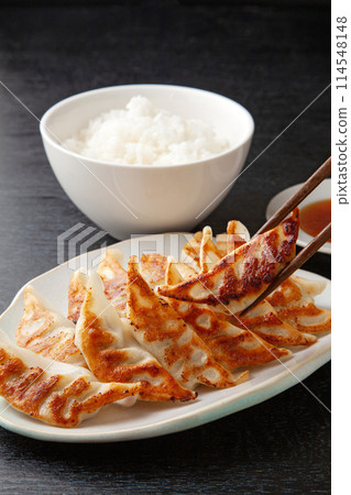 Dumplings and rice 114548148