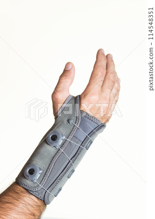 Bandage wrist with pressure regulator on a man's hand - isolate Bandage wrist with pressure regulator on a man's hand - isolate 114548351