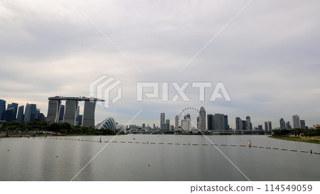 Singapore CBD city skyline view from Marina Barrage, with beautiful blue sky and white cloud. Singapore CBD city skyline view from Marina Barrage, with beautiful blue sky and white cloud. 114549059