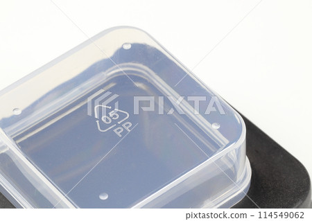 Empty small transparent and black plastic box isolated on white background. Empty small transparent and black plastic box isolated on white background. 114549062