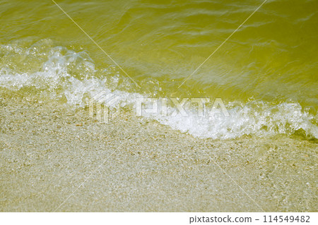 Sea wave on a sandy beach 114549482
