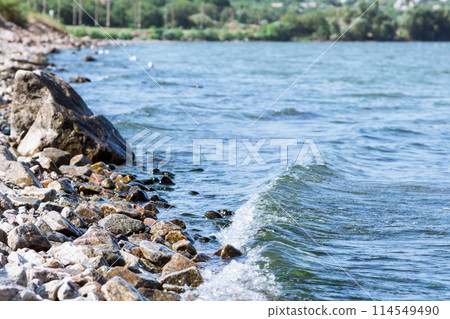 Sea wave on a granite beach 114549490