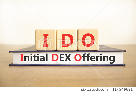 IDO initial DEX offering symbol. Concept words IDO initial DEX offering on beautiful wooden blocks and book. Beautiful white background. Business IDO initial DEX offering concept. Copy space. IDO initial DEX offering symbol. Concept words IDO initial DEX offering on beautiful wooden blocks and book. Beautiful white background. Business IDO initial DEX offering concept. Copy space. 114549681