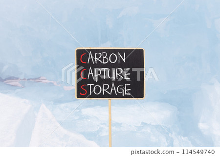 CCS Carbon capture storage symbol. Concept words CCS Carbon capture storage on beautiful yellow blackboard. Beautiful blue ice background. Business ecological Carbon capture storage concept Copy space 114549740