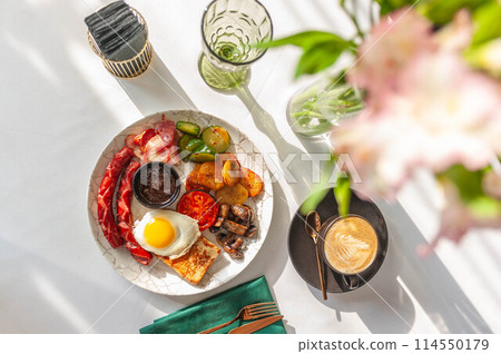 Light breakfast in a restaurant with a cup of coffee. Light breakfast in a restaurant with a cup of coffee. 114550179