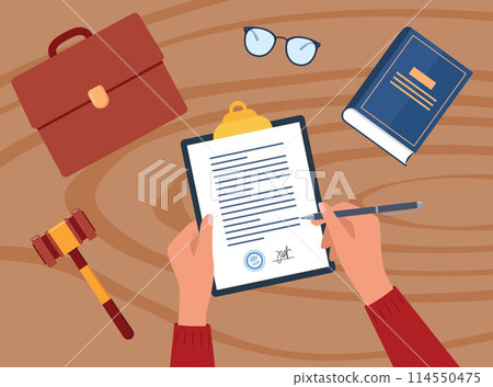Civil law concept. Business man hand signing a paper document. Gavel and judge book on wooden table. Workplace desk top view. 114550475