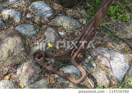 Old rusty metal mount from agricultural plough 114550760