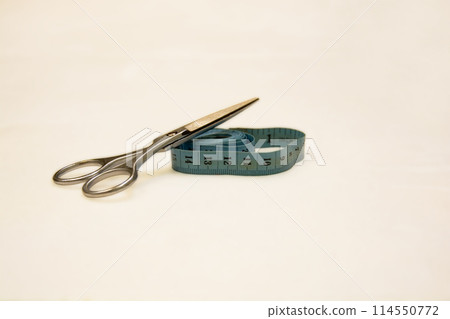 Scissors and centimeter on a white background 114550772