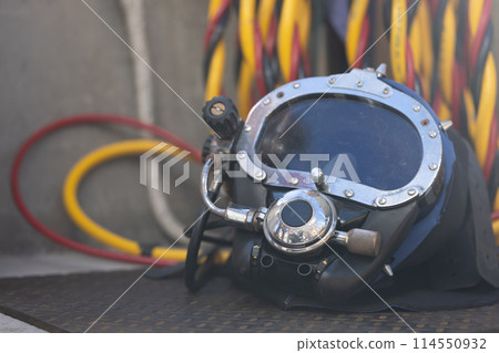 Closeup of commercial diving helmet on the boat 114550932
