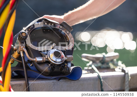 Closeup of commercial diving helmet on the boat Closeup of commercial diving helmet on the boat 114550938