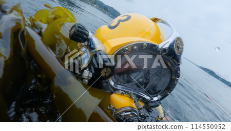 Closeup of commercial diver in helmet 114550952