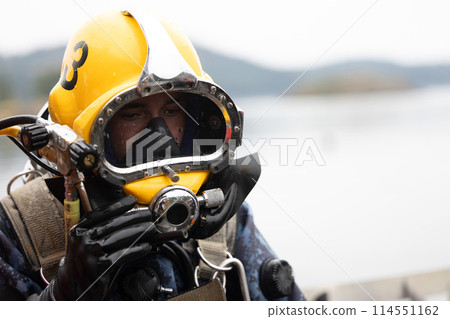 Closeup of commercial diver in helmet 114551162