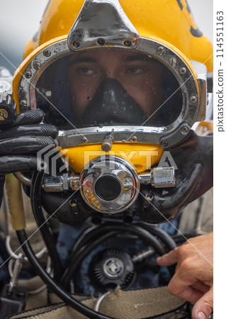 Closeup of commercial diver in helmet 114551163
