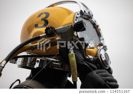 Closeup of commercial diver in helmet 114551167