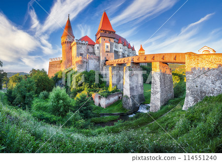 Amazing panoramic morning view of Hunyad Castle / Corvin's Castle with wooden bridge. Amazing panoramic morning view of Hunyad Castle / Corvin's Castle with wooden bridge. 114551240