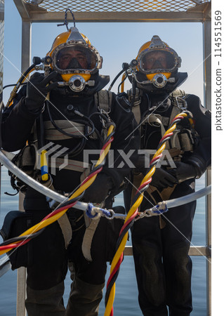 Commercial diver prepared for deep water entry Commercial diver prepared for deep water entry 114551569