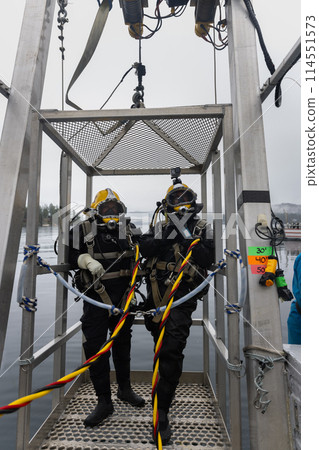 Commercial diver prepared for deep water entry 114551573