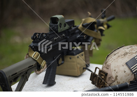 airsoft weapon machine gun, staged photo of airsoft equipment, military theme 114551986
