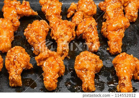cooked chicken legs fried in batter, street food in Thailand, selective focus 114552012
