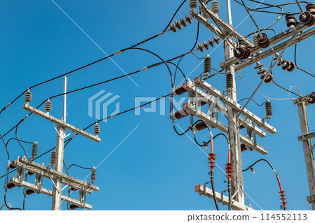 electrical wires with insulators on concrete pillars 114552113