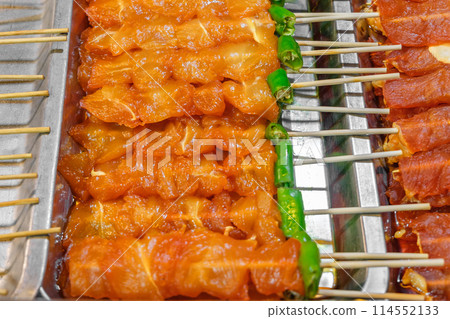 grilled chicken skewers with sweet sauce on food stall, selective focus grilled chicken skewers with sweet sauce on food stall, selective focus 114552133