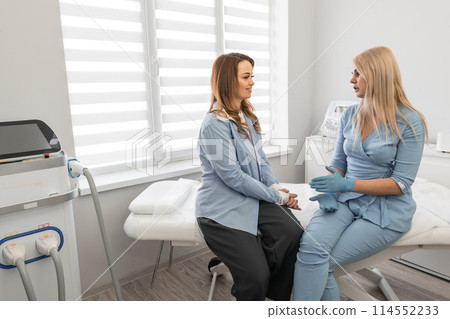 Dialogue about beauty: The patient in consultation with a cosmetologist in a beauty salon, where a professional approach to solving cosmetic problems sounds. Peer review: Professional examination and Dialogue about beauty: The patient in consultation with a cosmetologist in a beauty salon, where a professional approach to solving cosmetic problems sounds. Peer review: Professional examination and 114552233