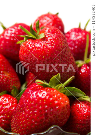 Ripe tasty strawberries with green leaves Ripe tasty strawberries with green leaves 114552403