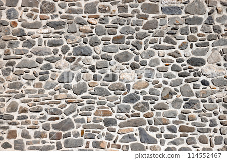 Wall constructed with various natural stones 114552467