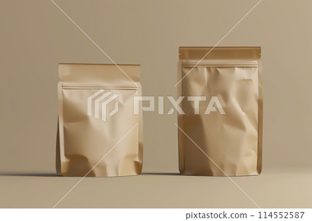 Two blank brown kraft paper pouches on a beige background, ideal for branding mockups 114552587