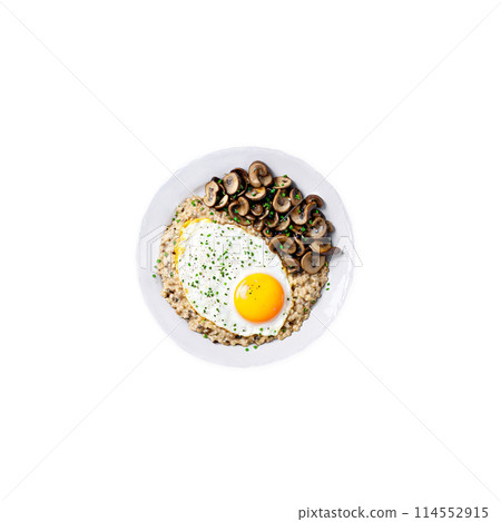 Savory oatmeal creamy oats topped with a fried egg sauteed mushrooms 114552915