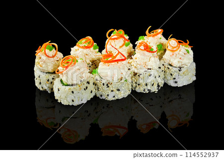 Exquisite sushi rolls with creamy seafood caps on black Exquisite sushi rolls with creamy seafood caps on black 114552937