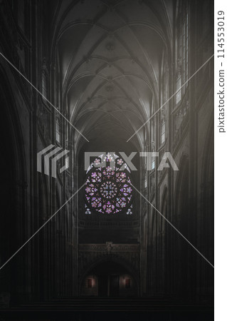 Gothic cathedral interior with stained glass window 114553019