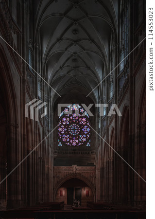 Gothic cathedral interior with stained glass window 114553023
