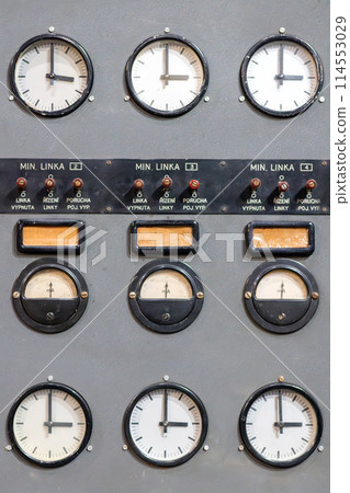 Old electric voltage clocks on radio amplifier 114553029