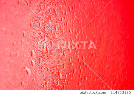 Water drops on red background. Water droplets on the glass. 114553180
