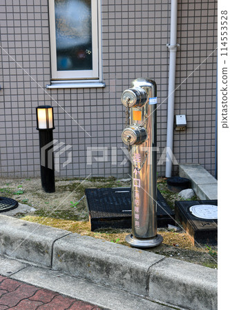 Fire hydrant on the street near old town of osaka Japan. Fire hydrant on the street near old town of osaka Japan. 114553528