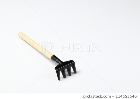rake, gardening supplies, tools to cultivate gardens, Basic gardening tools isolated on white background. rake, gardening supplies, tools to cultivate gardens, Basic gardening tools isolated on white background. 114553540