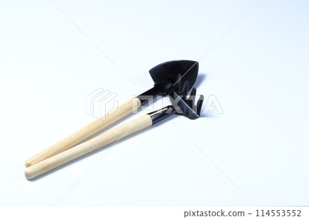 rake and shovel, Set of gardening supplies, tools to cultivate gardens, Basic gardening tools isolated on white background. rake and shovel, Set of gardening supplies, tools to cultivate gardens, Basic gardening tools isolated on white background. 114553552