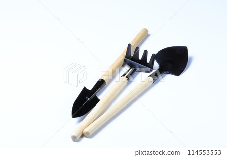 rake and shovel, Set of gardening supplies, tools to cultivate gardens, Basic gardening tools isolated on white background. rake and shovel, Set of gardening supplies, tools to cultivate gardens, Basic gardening tools isolated on white background. 114553553