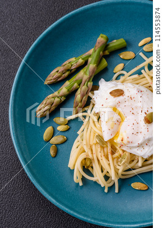 Delicious hearty breakfast consisting of poached eggs on toast with cream cheese, asparagus Delicious hearty breakfast consisting of poached eggs on toast with cream cheese, asparagus 114553874