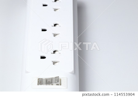 Closeup of electrical power strip or extension block on white background. Closeup of electrical power strip or extension block on white background. 114553904