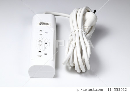 Closeup of electrical power strip or extension block on white background. Closeup of electrical power strip or extension block on white background. 114553912