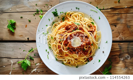 Delicious Homemade Spaghetti Bolognese with Fresh Parsley on Rustic Table Delicious Homemade Spaghetti Bolognese with Fresh Parsley on Rustic Table 114554263
