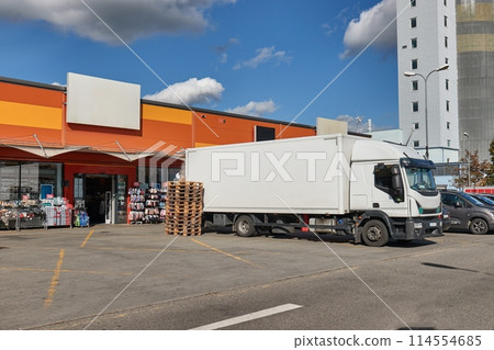 Truck delivering goods to shops 114554685