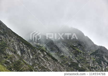 Clouds in the high mountain rocky landscape 114554788