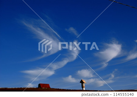 Huge blue sky.White clouds float against the background of a blue sky. Huge blue sky.White clouds float against the background of a blue sky. 114555140
